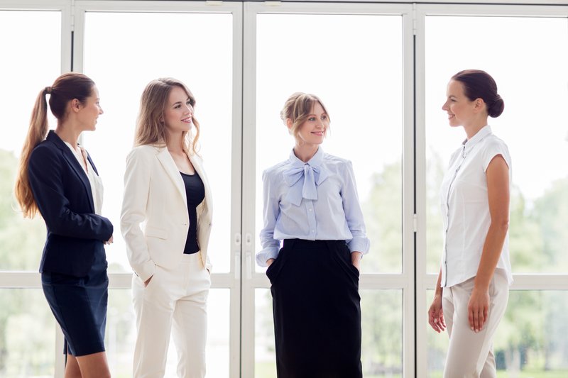 4 business women talking